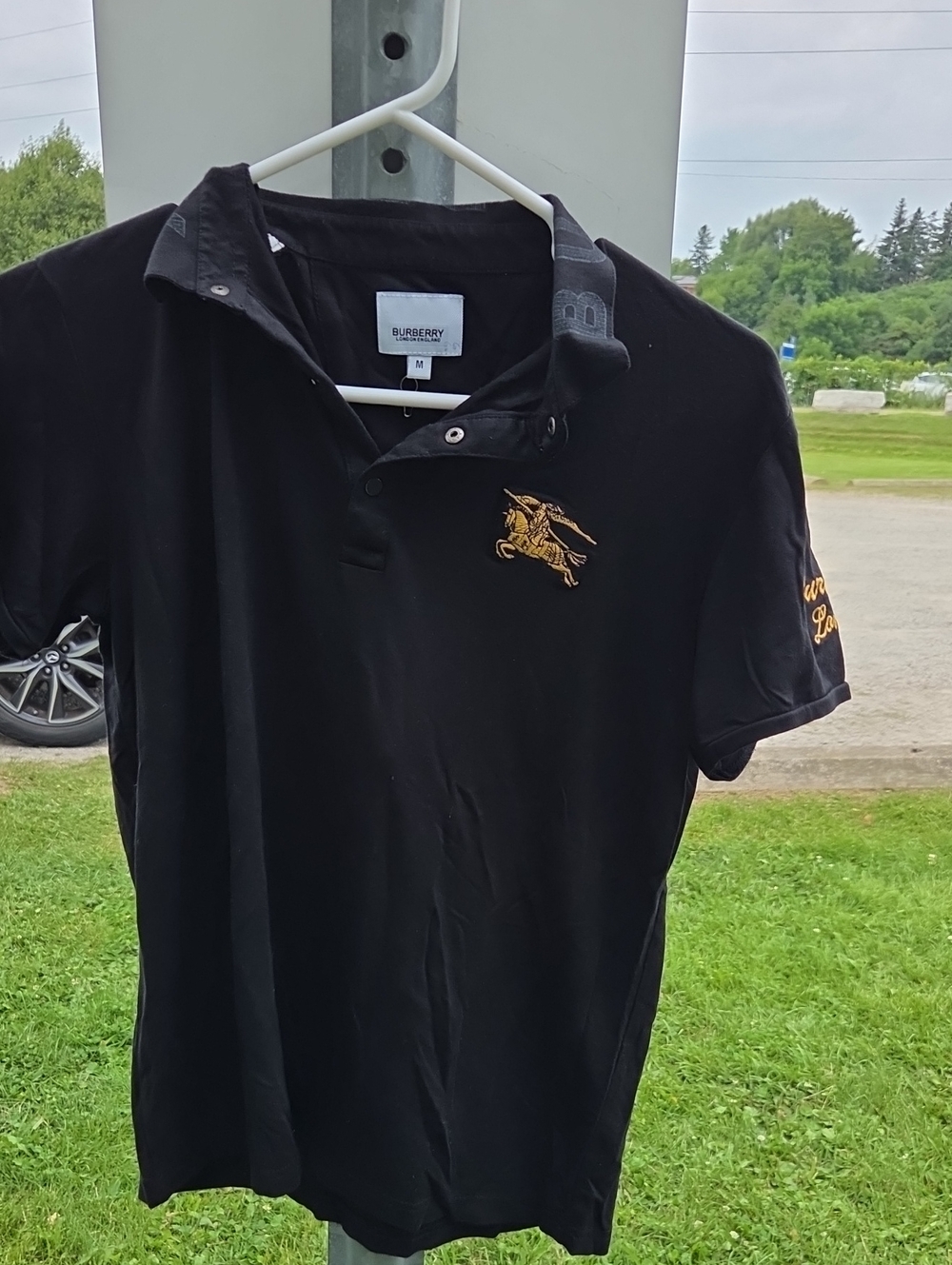 Burberry Black Polo with Gold Equestrian Embroidery